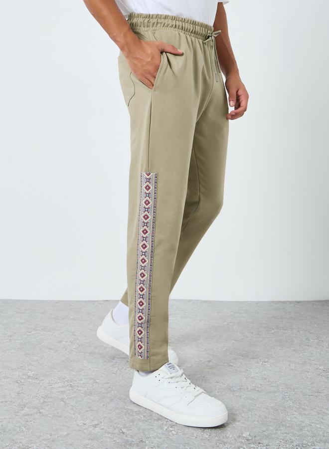 Styli Men Slim Fit Graphic Panel Joggers - Image 1